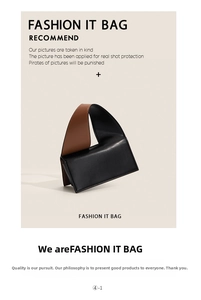 Detail of a chic black leather accordion bag featuring a wide brown contrast shoulder strap