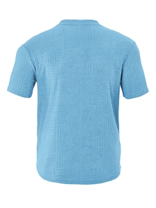 Detailed view of blue short-sleeve polo shirt featuring geometric knit texture fabric