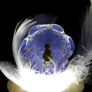 Luminous purple cat paw acrylic ornament with golden silhouette on wooden LED base