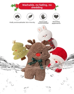 Detail of plush Christmas tree, reindeer, and Santa toys showing soft fluffy texture