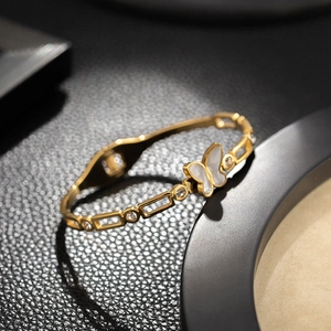 Luxury 18K gold butterfly bangle with shell inlay and cubic zirconia accents