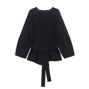 Elegant black V-neck long sleeve knit top with waist tie belt and peplum hem detail