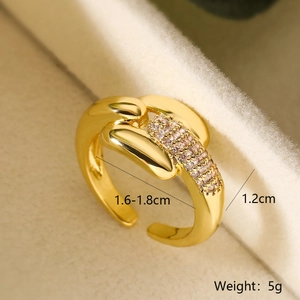 Detailed close-up of 18K gold plated chain ring with zircon inlay in a velvet box