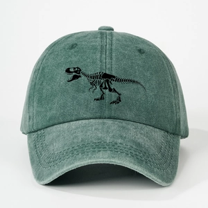 Close-up of vintage green washed cotton baseball cap with black dinosaur skeleton embroidery