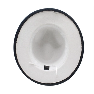 Internal detail showing adjustable drawstring and material label on bicolor fedora hat
