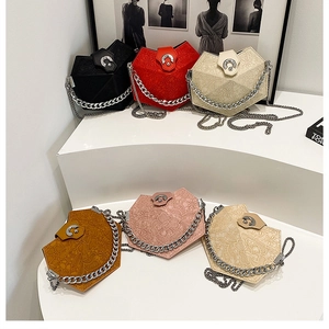 Collection of geometric diamond-pattern crossbody bags in six colors with silver chains
