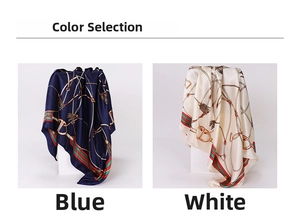 Detail view of 90cm square silk scarf with chain print and tassel pattern in blue and white