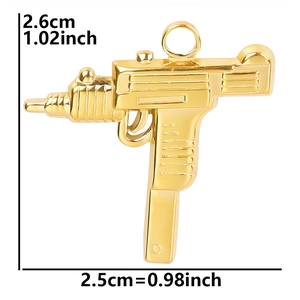Detail showing 2.6cm by 2.5cm dimensions of the 18k gold plated gun-shaped pendant
