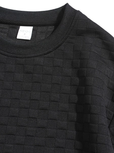 Macro shot of men's slim fit sweatshirt neck line with waffle texture and size S tag