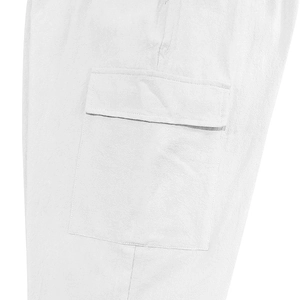 Detailed macro view of side cargo pocket design on white linen pants for men