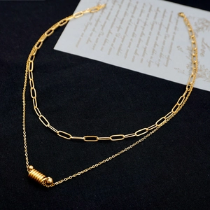 Double-layered gold titanium necklace with paperclip chain and cylindrical pendant