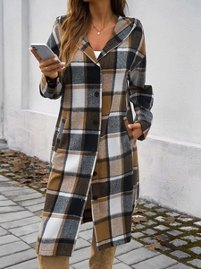 Detail of a long hooded jacket for women featuring a brown black and white plaid pattern