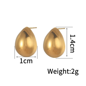 Detailed size view of gold teardrop earrings measuring 1.4cm high and weighing 2g each