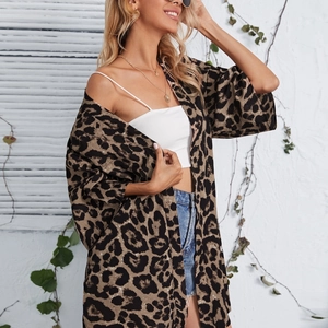 Detail shot of sheer leopard print long sleeve cardigan with lapel on a model