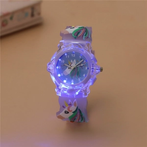Detailed close-up of LED glowing unicorn watch with purple silicone strap for kids