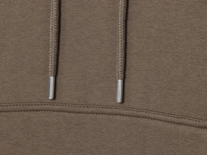 Detailed close-up of brown knitted hoodie with metallic drawstring tips for women