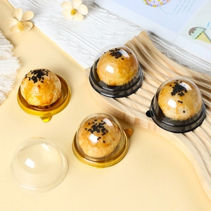 Transparent round pastry boxes with gold and black bases for egg yolk crisp and mooncakes