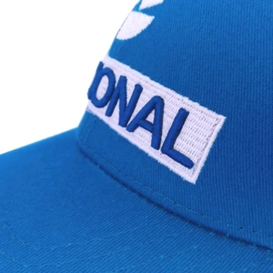 Blue cotton baseball cap featuring white embroidered NACIONAL letters and side logo