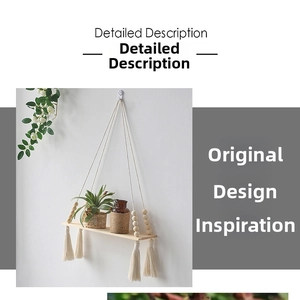 Detail of bohemian woven cotton rope wall shelf featuring light wood and hanging tassels