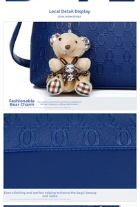 Detail of navy blue embossed leather tote with neat stitching and plush bear charm