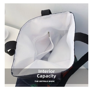 Interior view of the tote bag showing white lining and zipper pocket for storage