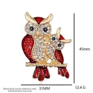Detail showing red owl brooch dimensions 45mm by 31mm with weight 12.4g specs