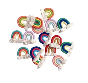 Detail shot of colorful hand-woven rainbow tassel charms for DIY crafts and accessories