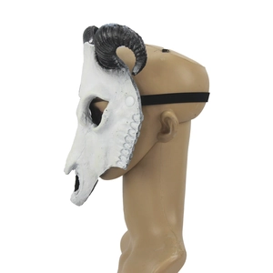 Side view of realistic goat skull mask with spiral horns and black elastic strap