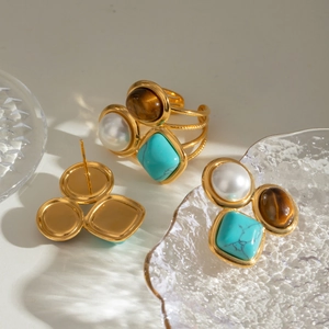 Vintage jewelry set with pearl, turquoise, and tiger eye stone in gold plated finish