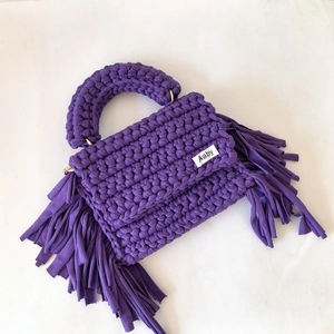Handmade purple crochet bag with fringe tassels and wide handle in bohemian style