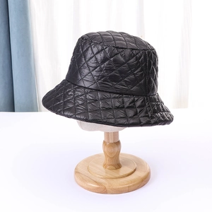 Detailed view of the diamond quilted pattern on a black lightweight thermal bucket hat