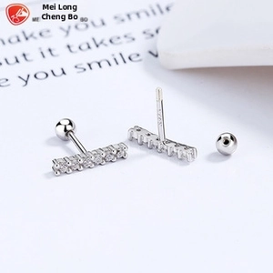 Macro shot of 925 sterling silver bar earrings with cubic zirconia and screw-back balls