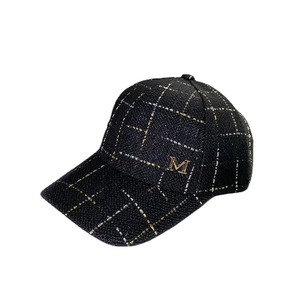 Women's black tweed baseball cap with gold metallic M logo and sparkling plaid texture