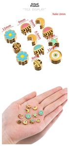 Detailed size view of colorful enamel flower and celestial charms for DIY jewelry making