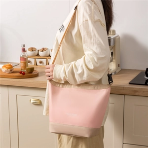Pink and beige insulated lunch bag with adjustable shoulder strap for outdoor picnic