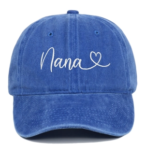 Detailed close-up of Nana embroidery and white heart on washed navy cotton baseball cap