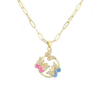 Detail of 18K gold necklace with circular pendant featuring pink and blue enamel butterflies
