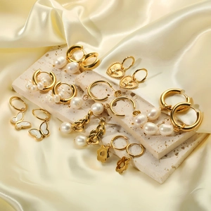 18k gold plated stainless steel pearl earring set with butterfly and floral designs