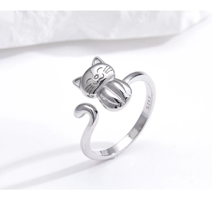 Macro shot of S925 sterling silver cat ring showing the hallmark engraving and polished finish