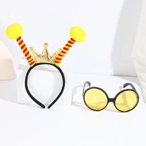 Close-up of yellow bee costume accessories with gold crown headband and tinted sunglasses