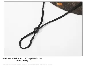 Detail of adjustable black nylon windproof chin strap on camouflage outdoor fishing hat