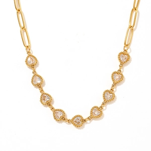 Golden paperclip chain necklace with heart-shaped zircon pendants on white background