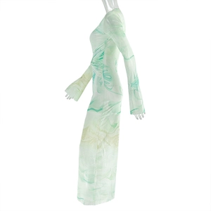 Detail of elegant green marble print long dress showing side silhouette and slim fit tailoring