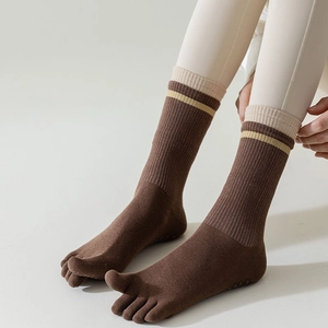 Brown five-finger yoga socks with beige stripes and anti-slip silicone dots on sole