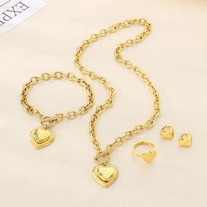 Chic gold stainless steel jewelry set featuring heart charms and toggle closure links