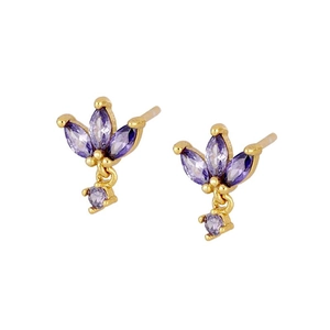 Detailed macro view of gold butterfly earrings set with sparkling purple zircon stones