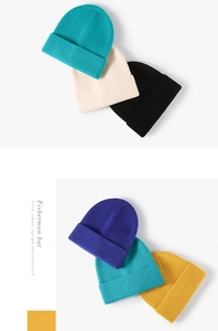 Detail view of colorful ribbed knit beanies showing thick cuffs and premium textures