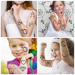Black and white cartoon temporary tattoos for kids featuring stars, planets and hearts