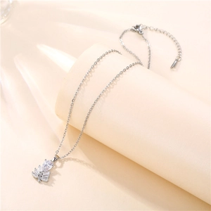 Detail of silver leaf pendant with sparkling cubic zirconia on a delicate cable chain