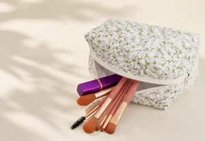 Detail view of the floral quilted makeup bag with smooth zipper and high capacity storage